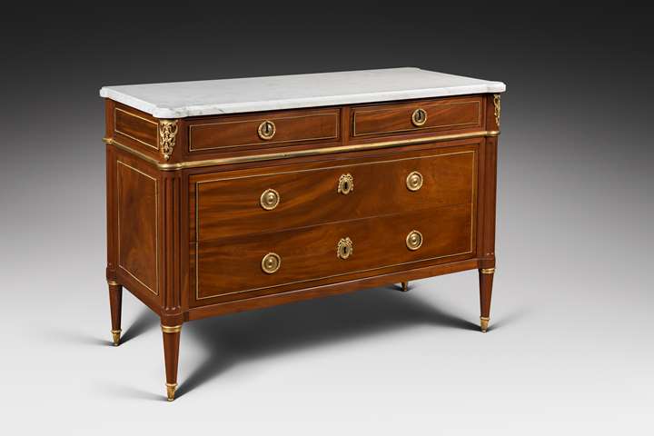 An elegant Louis XVI ormolu-mounted mahogany commode